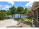Beautiful backyard with deck, patio, mature trees, and stunning lake views at 635 Stone Harbor Sw Pkwy, Marietta, GA 30060