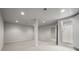 Finished basement featuring carpet floors, recessed lighting, a supporting pillar, and an adjacent tiled shower at 635 Stone Harbor Sw Pkwy, Marietta, GA 30060