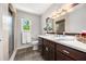 Well-lit bathroom featuring a vanity with dark wood cabinets at 635 Stone Harbor Sw Pkwy, Marietta, GA 30060