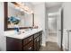 Bathroom featuring a vanity with dark wood cabinets and plenty of natural light at 635 Stone Harbor Sw Pkwy, Marietta, GA 30060