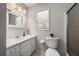 Neutral bathroom has a bright vanity, and shower stall at 635 Stone Harbor Sw Pkwy, Marietta, GA 30060