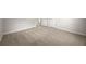 Large bedroom area with neutral paint, carpeting and a view into another room at 635 Stone Harbor Sw Pkwy, Marietta, GA 30060