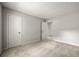 Bedroom with neutral paint and plush carpeting and a view to another room at 635 Stone Harbor Sw Pkwy, Marietta, GA 30060