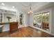 Cozy dining space with wood floors, a view to the screened porch and connection to the kitchen at 635 Stone Harbor Sw Pkwy, Marietta, GA 30060