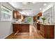 Well-lit kitchen with wood cabinets, granite counters, and a garden window for natural light at 635 Stone Harbor Sw Pkwy, Marietta, GA 30060