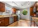 Modern kitchen with wood cabinets, granite countertops, stainless steel appliances, and a garden window at 635 Stone Harbor Sw Pkwy, Marietta, GA 30060