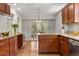 Beautiful kitchen with custom wood cabinets, granite countertops, and stainless steel dishwasher at 635 Stone Harbor Sw Pkwy, Marietta, GA 30060