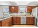 Kitchen features stainless steel appliances, granite countertops, and wood cabinets at 635 Stone Harbor Sw Pkwy, Marietta, GA 30060