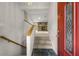 Bright entryway of a home featuring a staircase leading to a spacious living room with stone fireplace at 635 Stone Harbor Sw Pkwy, Marietta, GA 30060