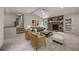 Bright living room featuring a stone fireplace, neutral decor, and large windows for natural light at 635 Stone Harbor Sw Pkwy, Marietta, GA 30060