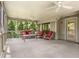 Relax on the screened-in porch with comfortable seating and views of the surrounding greenery at 635 Stone Harbor Sw Pkwy, Marietta, GA 30060