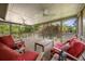 Enjoy outdoor living on the screened-in porch with views of the lake at 635 Stone Harbor Sw Pkwy, Marietta, GA 30060