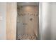 Contemporary shower stall with neutral tiles and built-in bench at 635 Stone Harbor Sw Pkwy, Marietta, GA 30060