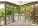 Inviting sunroom with wall-to-wall windows and a view of the lake at 635 Stone Harbor Sw Pkwy, Marietta, GA 30060