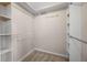 Walk-in closet with built-in shelving and rod provides ample storage space at 635 Stone Harbor Sw Pkwy, Marietta, GA 30060