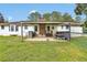 The backyard features a covered patio with a picnic table, great for outdoor gatherings and enjoying the peaceful view at 95 Stephens Dr, Covington, GA 30016