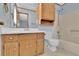 Bathroom with wood vanity and sink, and combination tub and shower at 95 Stephens Dr, Covington, GA 30016