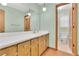 Bathroom with a large vanity and sink, large mirror and ample lighting at 95 Stephens Dr, Covington, GA 30016