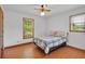 Bedroom with wood floors, ceiling fan and windows for plenty of natural light at 95 Stephens Dr, Covington, GA 30016