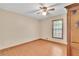 Empty bedroom with wood floors, ceiling fan and window at 95 Stephens Dr, Covington, GA 30016