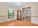 Traditional dining space showcasing wood floors, a china cabinet, and natural lighting at 95 Stephens Dr, Covington, GA 30016