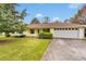 Charming single-story home with a well-manicured lawn, front porch, and a two car garage at 95 Stephens Dr, Covington, GA 30016