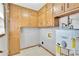 Laundry room with wooden cabinets for plenty of storage space, and a water heater at 95 Stephens Dr, Covington, GA 30016