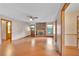 Comfortable living room featuring wood floors, a brick fireplace, and an abundance of natural light at 95 Stephens Dr, Covington, GA 30016