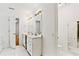 Bright bathroom featuring double sinks, tiled floor and a separate shower at 124 Crown Walk, Mcdonough, GA 30253