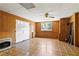 Bonus room with wood paneling, vinyl floors, window and convenient door to outside at 124 Crown Walk, Mcdonough, GA 30253