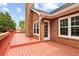 Enjoy outdoor gatherings on this spacious, raised deck with views of the backyard at 124 Crown Walk, Mcdonough, GA 30253