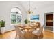 Dining room featuring hardwood floors and ample natural light, furnished with a dining table at 124 Crown Walk, Mcdonough, GA 30253