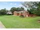 Lovely brick home featuring a spacious lawn and landscaping that offers great curb appeal at 124 Crown Walk, Mcdonough, GA 30253