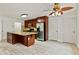 Open concept kitchen featuring a large island, stainless steel appliances, and hardwood flooring at 124 Crown Walk, Mcdonough, GA 30253
