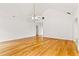 Unfurnished living room with vaulted ceilings and hardwood floors, ready for personalization at 124 Crown Walk, Mcdonough, GA 30253
