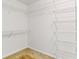 Spacious walk-in closet with white walls and ample wire shelving for organization at 124 Crown Walk, Mcdonough, GA 30253