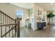 Bright foyer features stylish gray wood flooring, staircase, and a built-in desk area with a large window at 209 Maycrest Path, Tucker, GA 30084