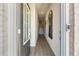 Inviting foyer featuring light wood floors, a staircase, and modern decorative mirror at 209 Maycrest Path, Tucker, GA 30084