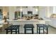 Spacious kitchen island with barstool seating and modern pendant lighting at 209 Maycrest Path, Tucker, GA 30084