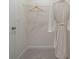 Walk-in closet featuring a wire shelf, a wooden hanger, and carpeted floors at 209 Maycrest Path, Tucker, GA 30084