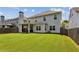 Spacious backyard with a covered patio, offering a perfect outdoor living space at 2624 Chase Rdg, Kennesaw, GA 30144