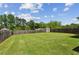 Large, well-maintained backyard featuring a wooden fence and a storage shed at 2624 Chase Rdg, Kennesaw, GA 30144