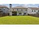 A spacious backyard featuring a covered patio and a large grassy area at 2624 Chase Rdg, Kennesaw, GA 30144