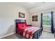 Comfortable bedroom featuring natural light from the window and dark wooden furniture at 2624 Chase Rdg, Kennesaw, GA 30144