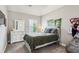 Cozy bedroom with a comfortable bed, white dresser, decorative accents, and ample natural light at 2624 Chase Rdg, Kennesaw, GA 30144
