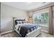A cozy bedroom with a comfortable bed, soft carpet, and plenty of natural light at 2624 Chase Rdg, Kennesaw, GA 30144