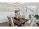 Open-concept dining area with views of the staircase and living room; chandelier above table at 2624 Chase Rdg, Kennesaw, GA 30144