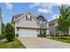 Charming two-story home with a well-manicured lawn and a welcoming front porch at 2624 Chase Rdg, Kennesaw, GA 30144