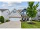 Charming two-story home with a well-manicured lawn and a welcoming front porch at 2624 Chase Rdg, Kennesaw, GA 30144