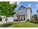 Charming two-story home with a well-manicured lawn and a welcoming front porch at 2624 Chase Rdg, Kennesaw, GA 30144